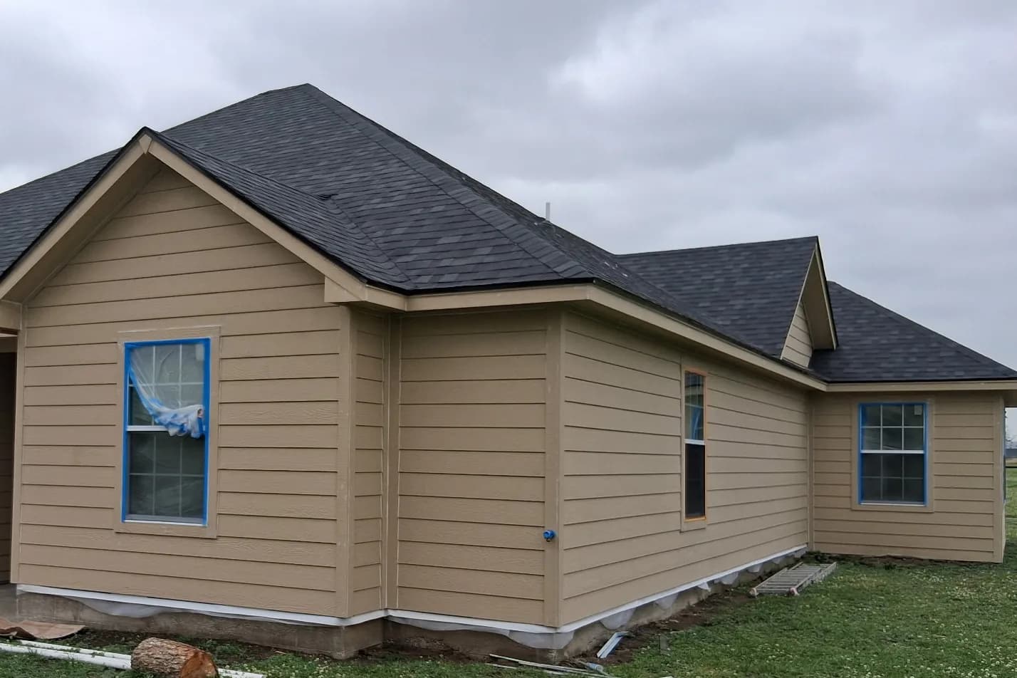 Roofing and siding work on the exterior of a Cherock project
